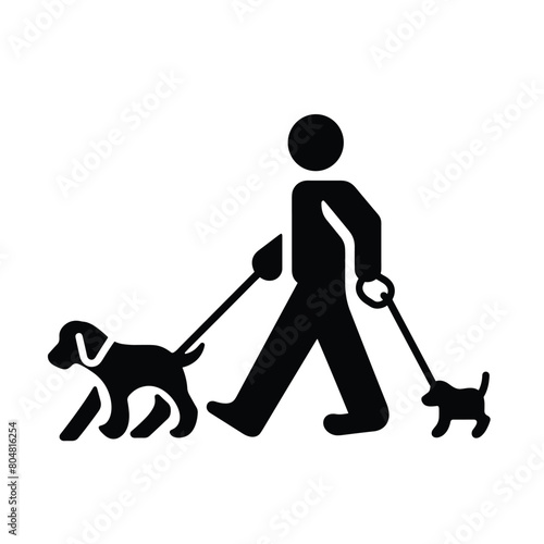 Silhouette of person walking two dogs on leashes.