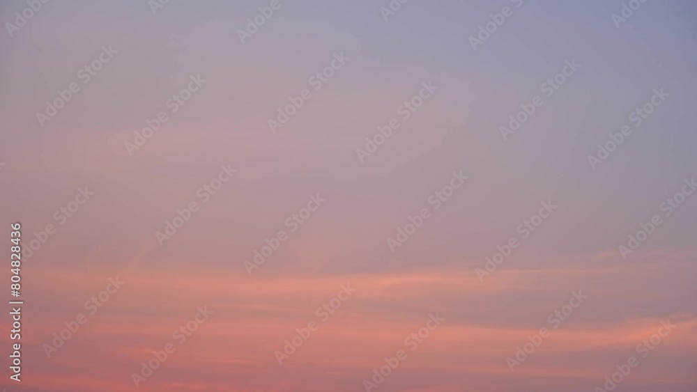 A time-lapse video captures the transition from the golden hues of sunset to the serene blues of the evening sky. Temperature concept. Video footage. Timelapse. Sky background.
A time-lapse video captures the transition from the golden hues of sunset to the serene blues of the evening sky. Temperature concept. Video footage. Timelapse. Sky background.