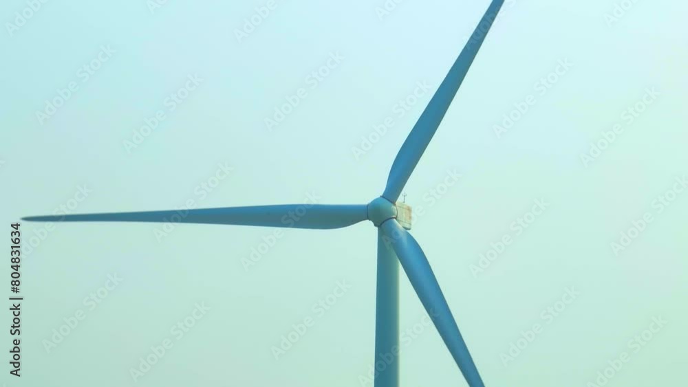 From above, a tableau of renewable energy emerges, where mighty turbines stand as sentinels of progress amidst rolling hills, painting a portrait of harmony between industry and environment.
From above, a tableau of renewable energy emerges, where mighty turbines stand as sentinels of progress amidst rolling hills, painting a portrait of harmony between industry and environment.