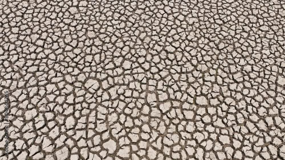 Behold, from the sky, a once-teeming lakebed now a haunting portrait of desiccation. Cracked earth sprawls endlessly, whispering tales of ecological distress and the dire need for intervention.
Behold, from the sky, a once-teeming lakebed now a haunting portrait of desiccation. Cracked earth sprawls endlessly, whispering tales of ecological distress and the dire need for intervention.