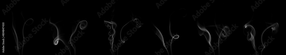 Collection set of white smoke moving on black background. Smoke clouds. Isolated abstract lines. Collection set of white smoke moving on black background. Smoke clouds. Isolated abstract lines.