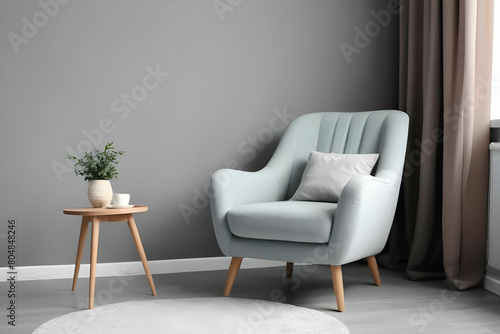 Stylish room interior with comfortable armchair and side table, space for text