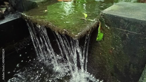 The artificial fountain in the fish pond