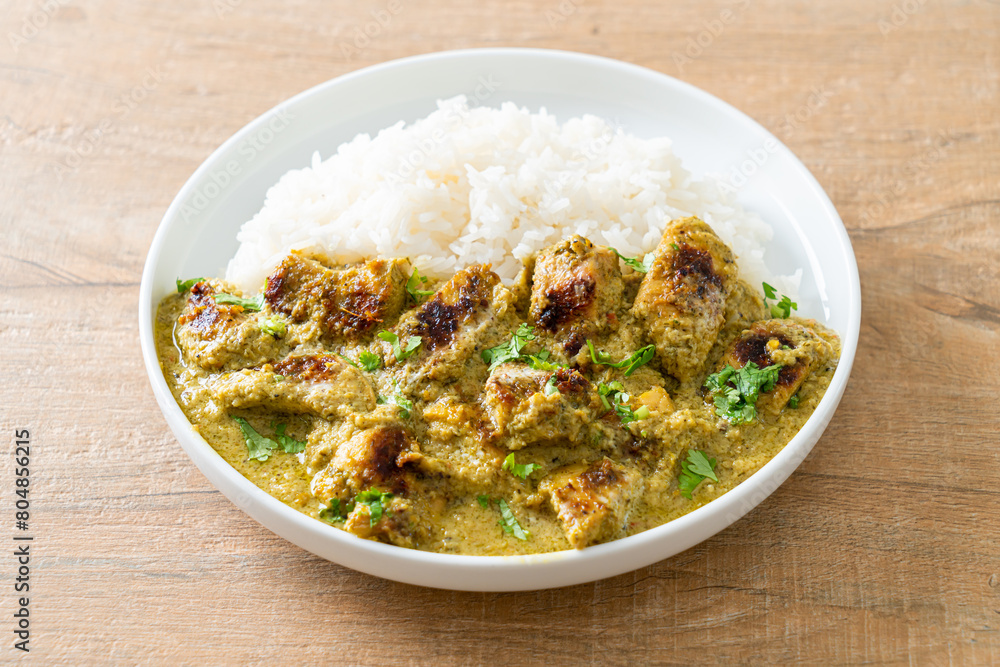 Afghani chicken in green curry or Hariyali tikka chicken hara masala with rice Afghani chicken in green curry or Hariyali tikka chicken hara masala with rice