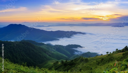 green mountain with fog and sunrise twilight sky at background © Santri