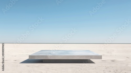 A minimalist gray table placed on a sandy beach