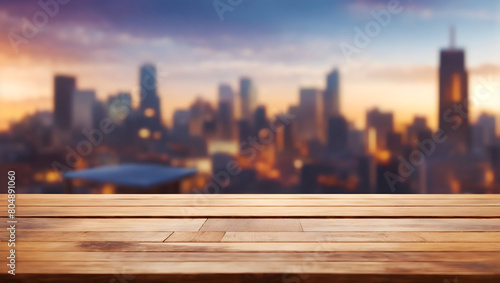 Image of empty wooden table in front of abstract blurred city background