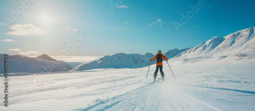 Skier in mountains in sunny day, concept of winter holiday and winter sports.  © theevening