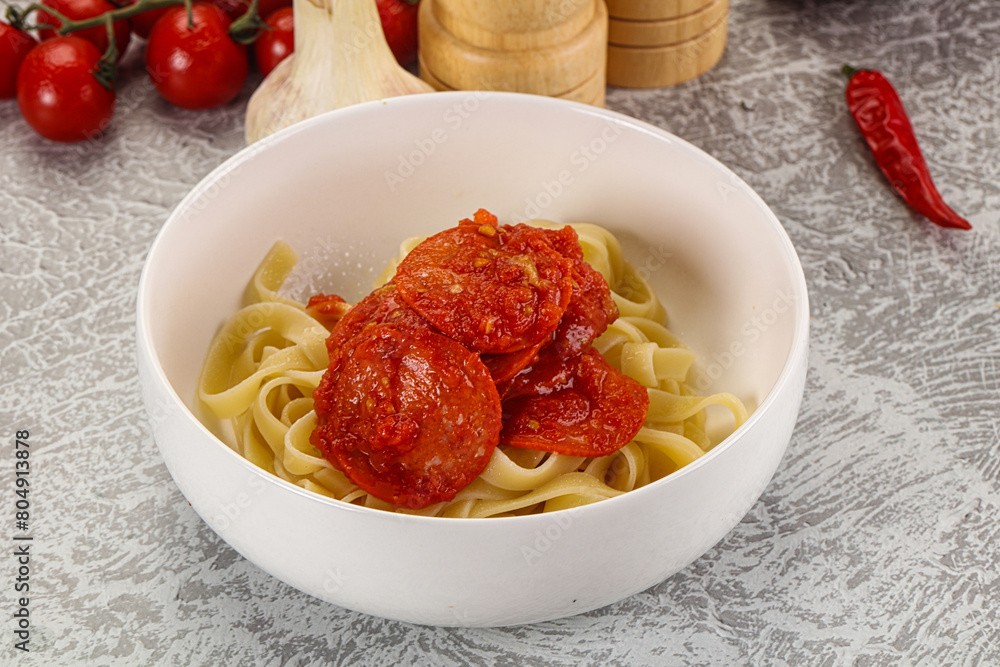 Italian pasta pappardelle with chorizo Italian pasta pappardelle with chorizo
