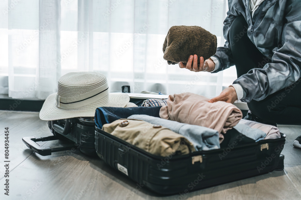 Preparing for a Getaway, Packing Essential Items in Suitcase Preparing for a Getaway, Packing Essential Items in Suitcase