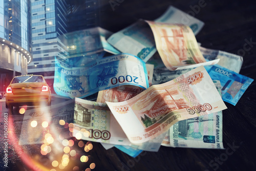 Russian money. Different denomination of bills. Finance concept. Double exposure city. photo