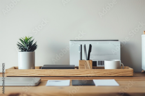 A set of contemporary desk accessories, such as a pen holder, memo pad holder, and business card holder, arranged in a row on a minimalist desk, keeping essentials organized in style.
