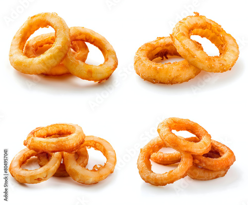Fried onion rings falling on a white background.