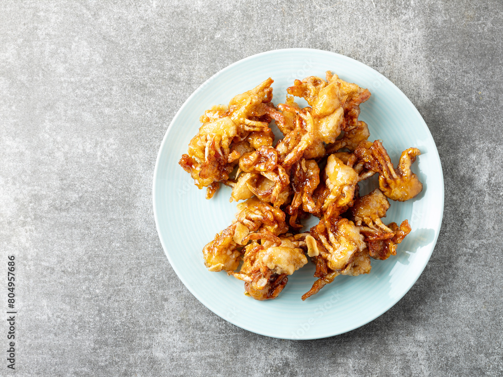 fried crab on a plate fried crab on a plate