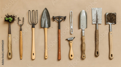 Set of gardening tools on beige background
