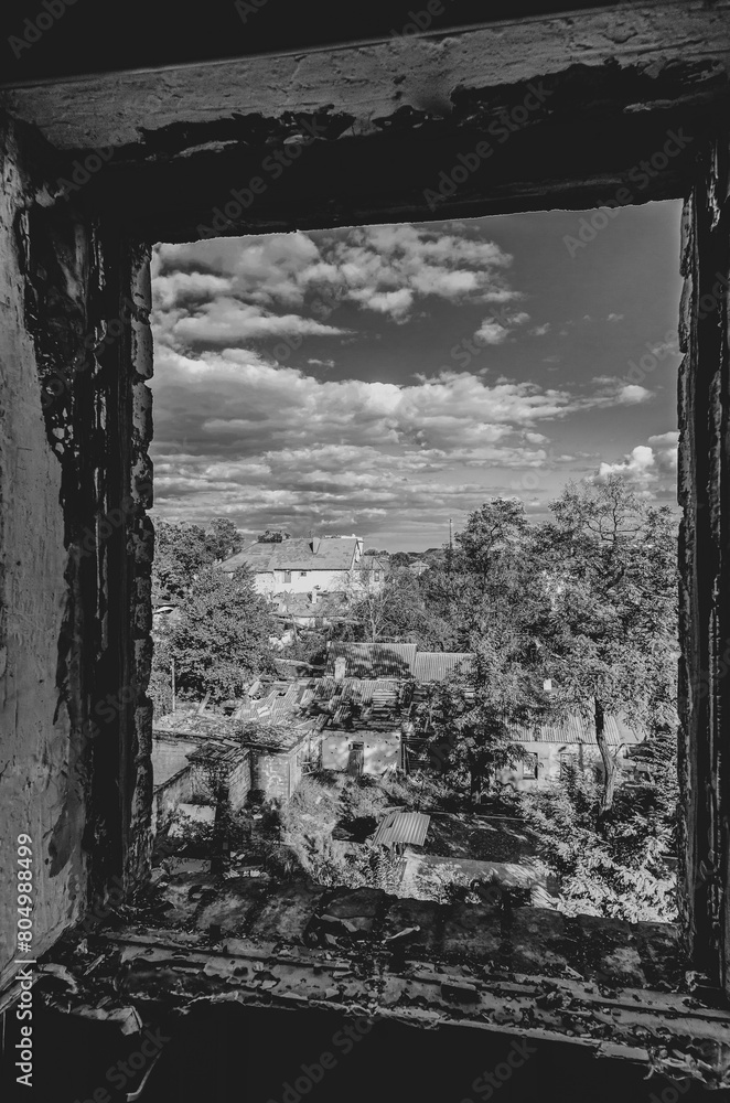 Fototapeta premium destroyed and burned houses in the city during the war in Ukraine