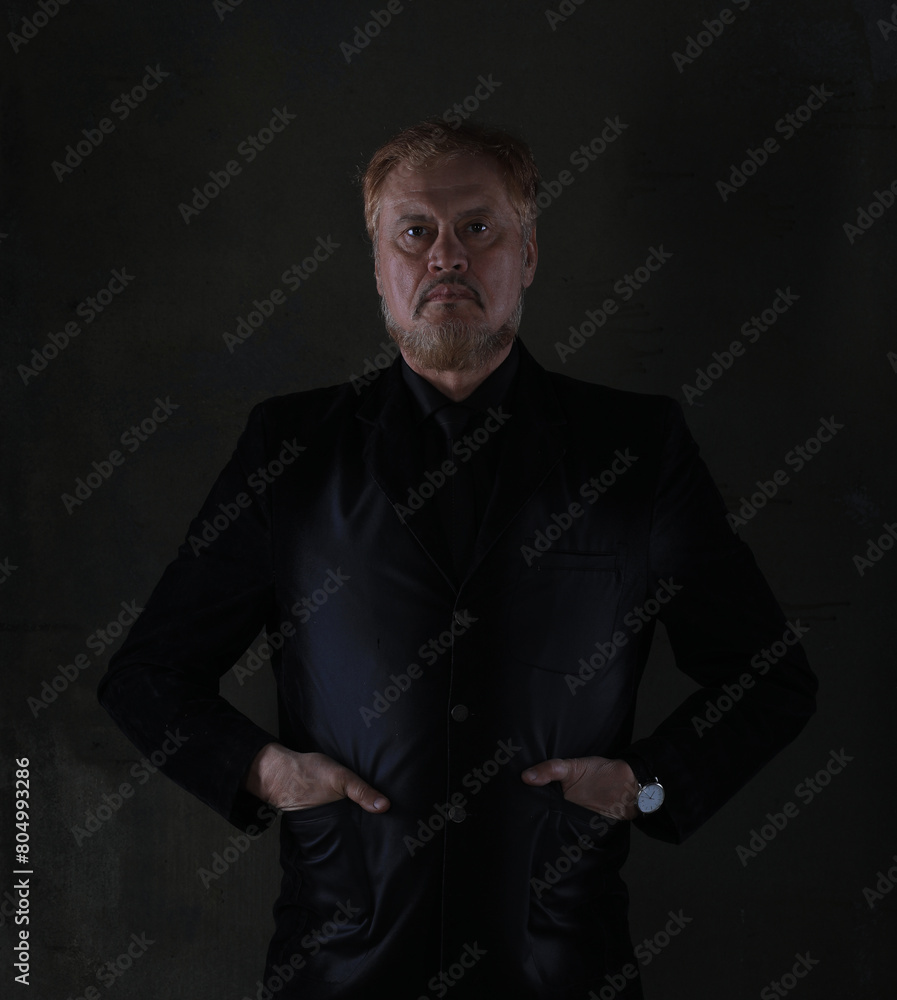 portrait of an old red-haired man in a black jacket portrait of an old red-haired man in a black jacket