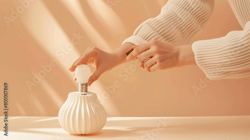 Woman changing light bulb in lamp on beige background