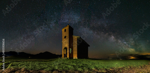 Hermitage of San Isidro, Tarilonte de la Peña, Palencia, under a starry sky with the Milky Way over the mausoleum photo