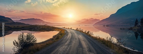 Lake District Panorama Photo with Road stretching out into the Distance. Beautiful Mountain Scene at Sunset.
