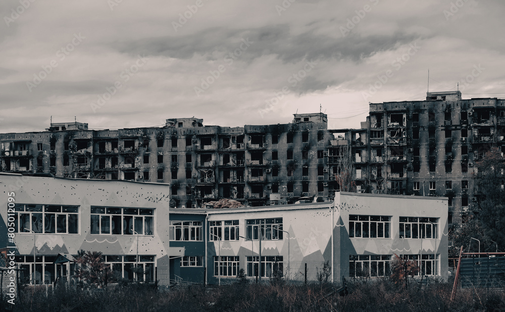 Fototapeta premium destroyed and burned houses in the city during the war in Ukraine