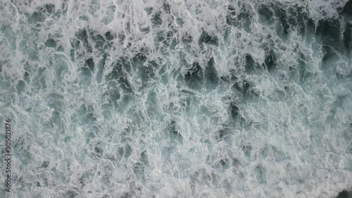 Waves that break on the reef on the coast of the island of Mauritius and slowly run out towards the island.