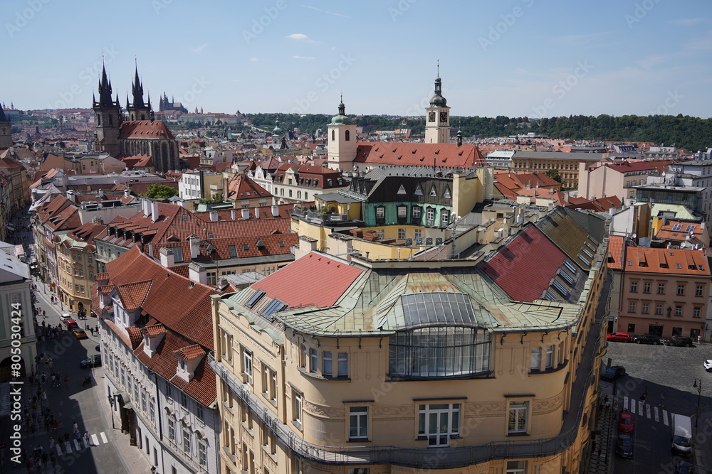 A scenic panorama showcasing the terracotta rooftops and historical towers of a charming european city Prague. Panorama of the Old Town architecture in Prague, Czech Republic A scenic panorama showcasing the terracotta rooftops and historical towers of a charming european city Prague. Panorama of the Old Town architecture in Prague, Czech Republic