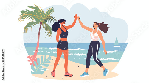 Fitness women laughing and high-fiving after a beach