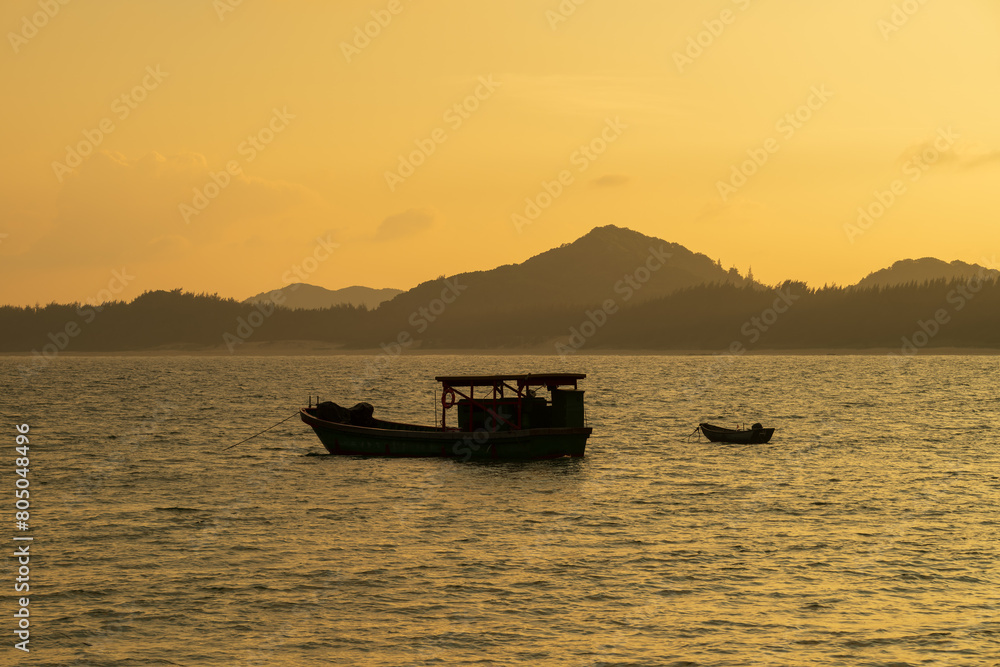 fishing boat silhouette at sunset