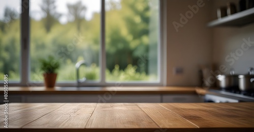 Empty wooden table top with blurred kitchen background for product placement. Product background