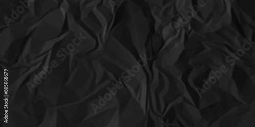 Dark black crumpled paper texture background. black crumpled and top view textures can be used for background of text or any contents. 