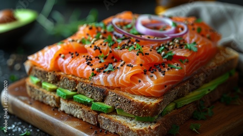 Open-Faced Smoked Salmon Sandwich with Avocado. Elegant open-faced sandwich topped with silky smoked salmon, ripe avocado slices, and fresh herbs on a hearty rye bread.