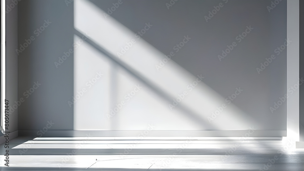 A minimalist interior with light from the window illuminating the interior of the room. A minimalist interior with light from the window illuminating the interior of the room.