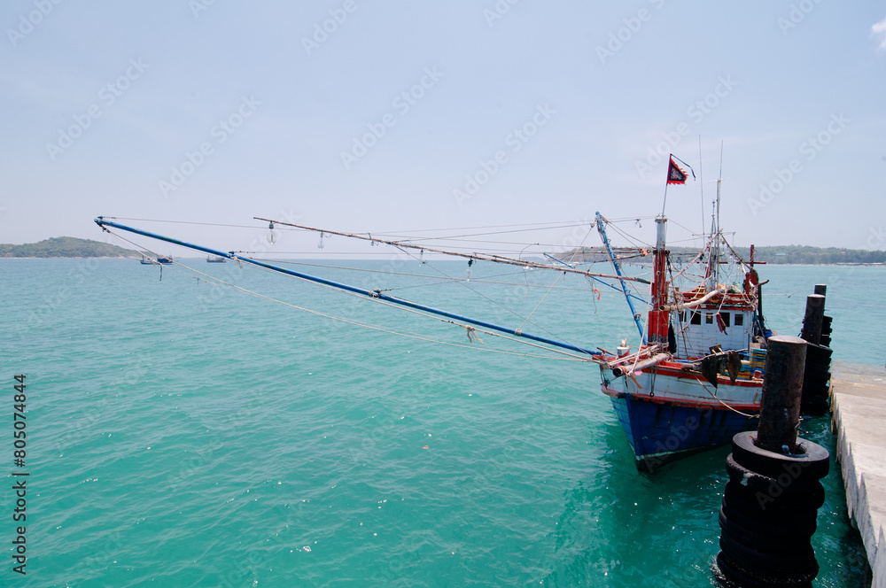 Traditional fishing boat for crab catching moored at wharf in Phuket, Thailand.