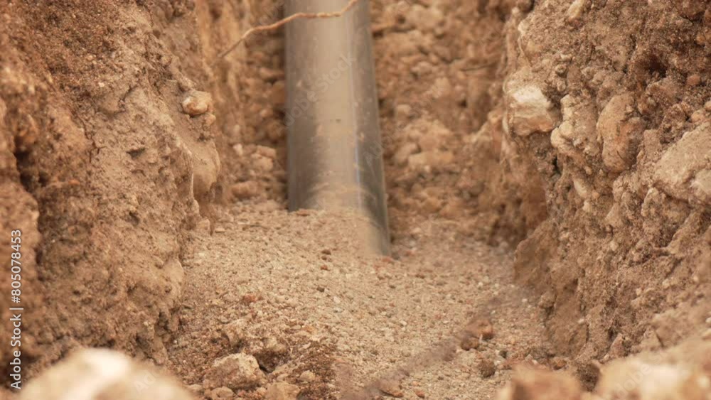 Trench, pipe, installation - Water plastic pipe installation in trench, underground placement. Construction, Infrastructure, development Trench, pipe, installation - Water plastic pipe installation in trench, underground placement. Construction, Infrastructure, development