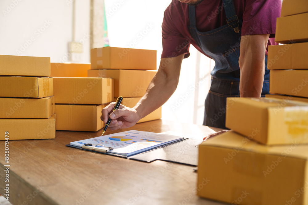 Thriving small businesses, often run by male freelancers, entrepreneurs, leverage e-commerce and logistics for online orders. home offices, manage packaging, shipping, client relations using laptops. Thriving small businesses, often run by male freelancers, entrepreneurs, leverage e-commerce and logistics for online orders. home offices, manage packaging, shipping, client relations using laptops.