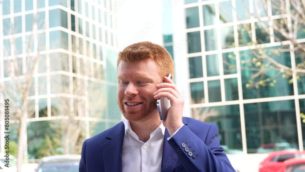 Cool businessman talking to the mobile while sitting outside in the city Cool businessman talking to the mobile while sitting outside in the city