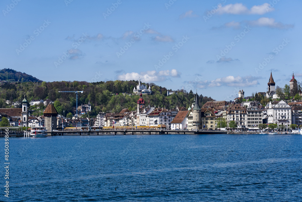Obraz premium Scenic view of Swiss City of Lucerne seen from passenger ship on Lake Lucerne on a sunny spring noon. Photo taken April 11th, 2024, Lucerne, Switzerland.