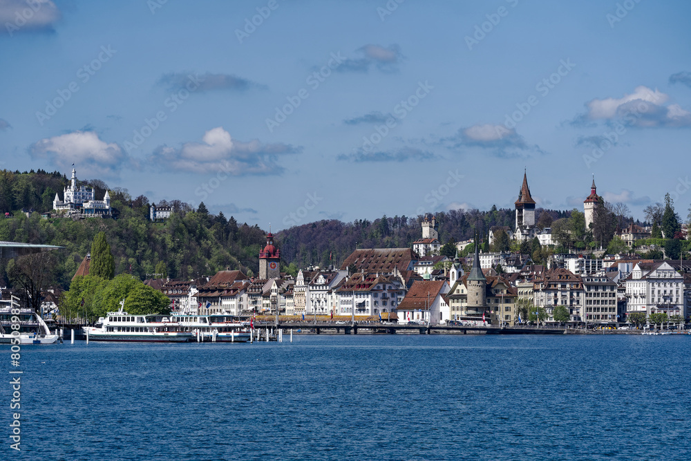Scenic view of Swiss City of Lucerne seen from passenger ship on Lake Lucerne on a sunny spring noon. Photo taken April 11th, 2024, Lucerne, Switzerland.