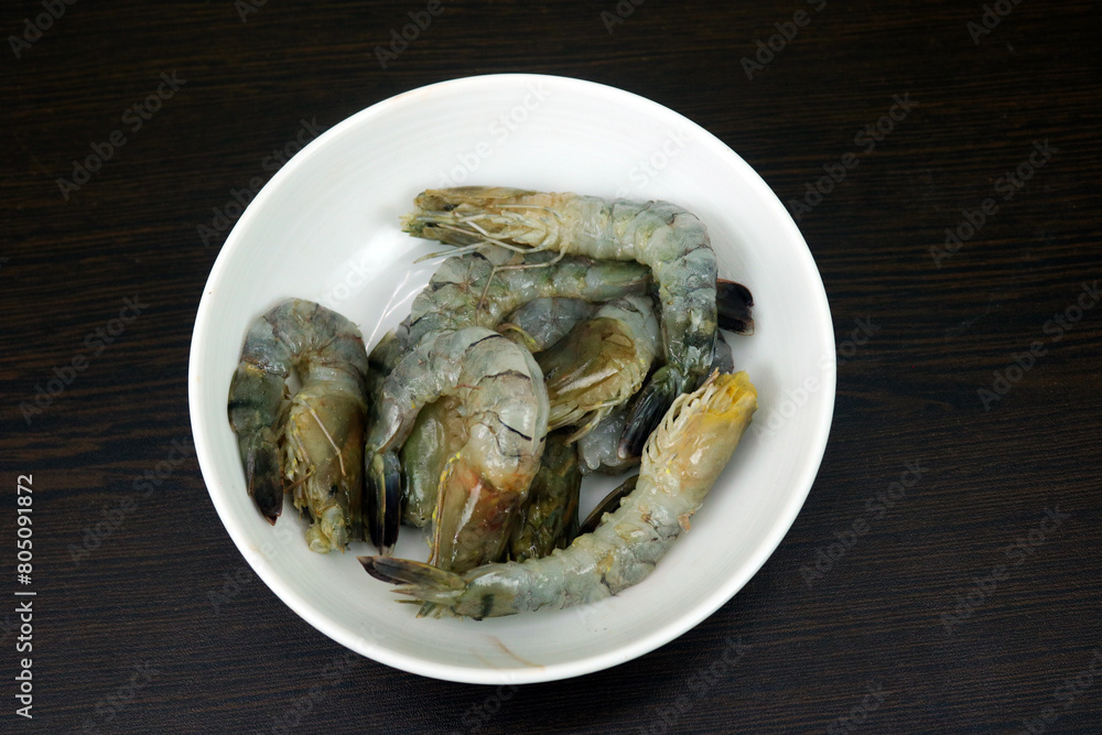 White Bowl Full of Shrimp on a Wooden Table White Bowl Full of Shrimp on a Wooden Table