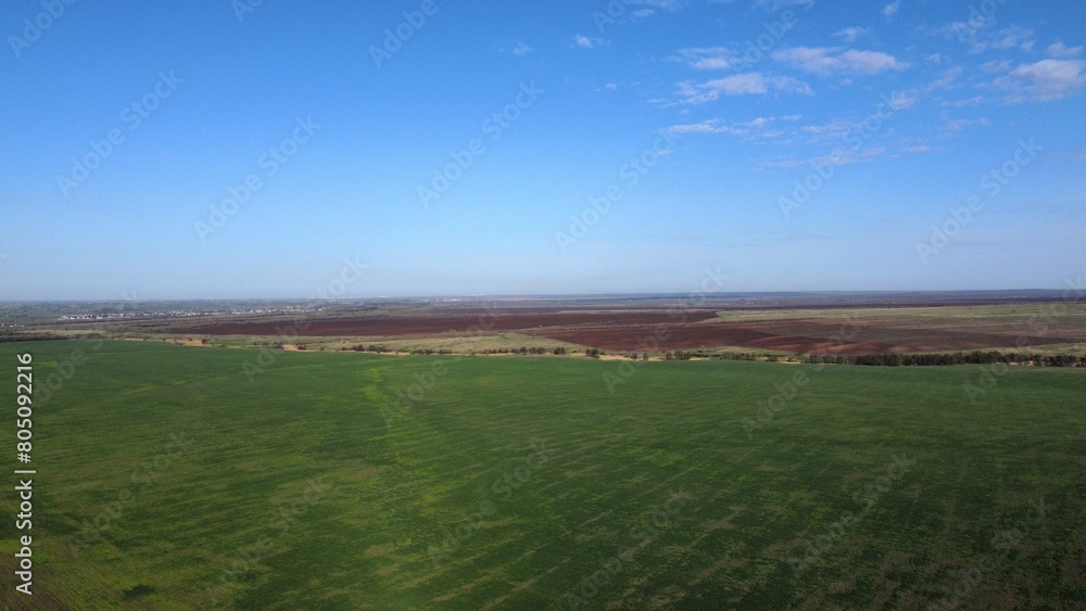 a black earth plowed field is waiting for planting in the spring