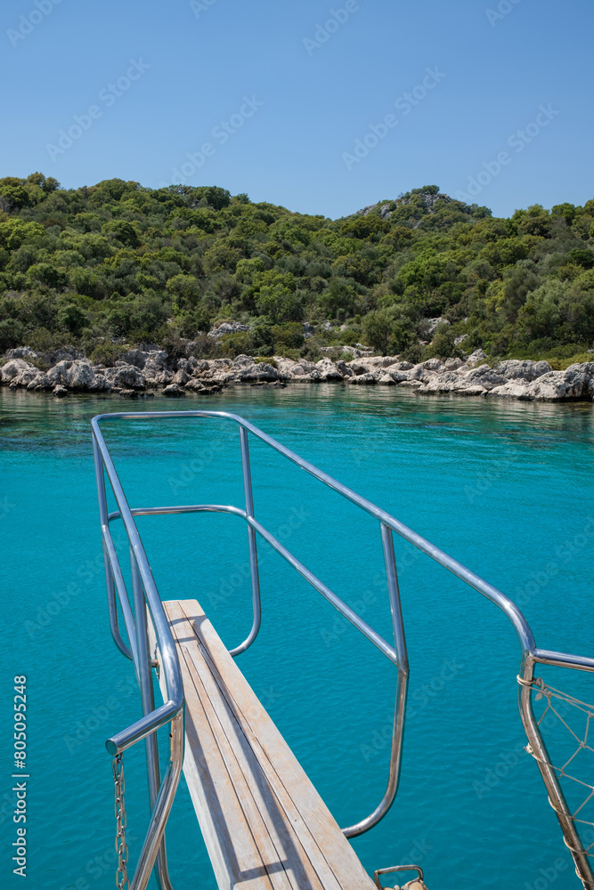 Boat bow extending our over blue water near Kekova Mediterranean Islands.