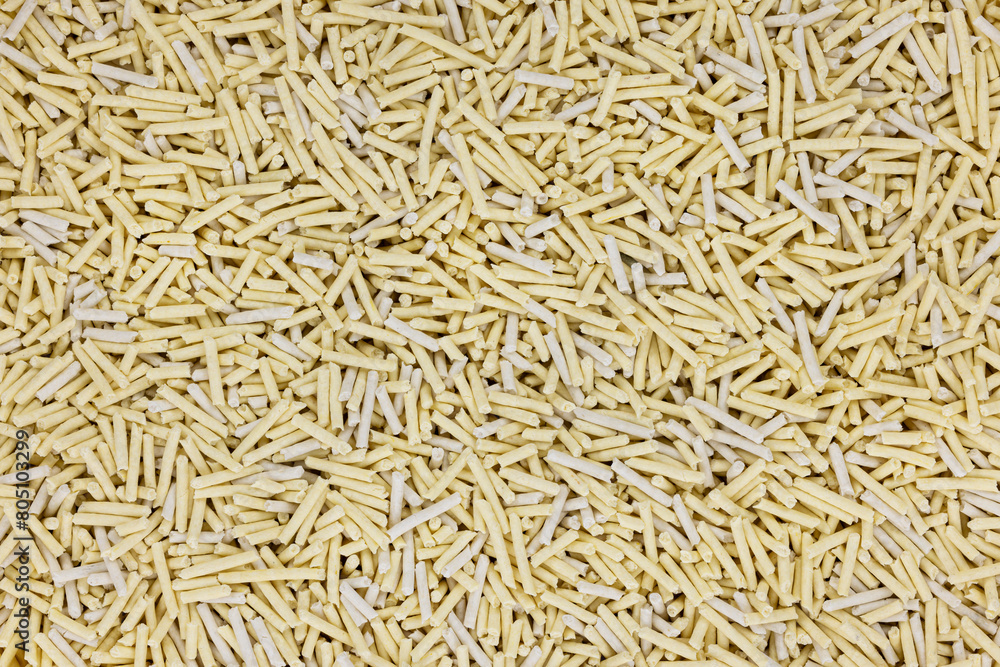 Full frame top view shot of yellowish tofu cat litter. Full frame top view shot of yellowish tofu cat litter.