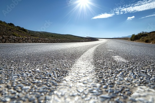 Wallpaper Mural A close-up of a road with lines stretching into the distance under a cloudy sky. Torontodigital.ca