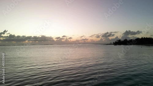 A timelapse drone shot of the sunrise of the island of Mauritius with the sea and the magnificent clouds on the horizon and the rising sun