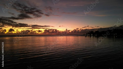 A timelapse drone shot of the sunrise of the island of Mauritius with the sea and the magnificent clouds on the horizon and the rising sun
