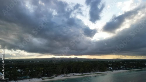 A timelapse drone shot of the sunset of the island of Mauritius with the sea and the magnificent clouds on the horizon and the setting sun