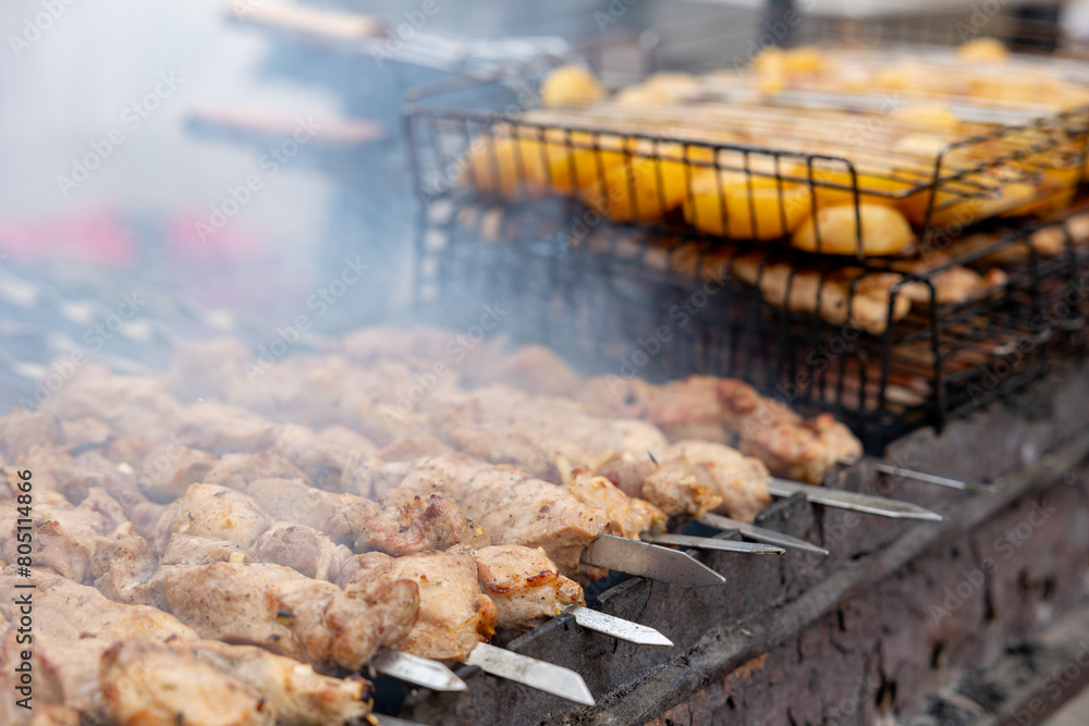 Many kebabs are prepared on the grill. Street food.