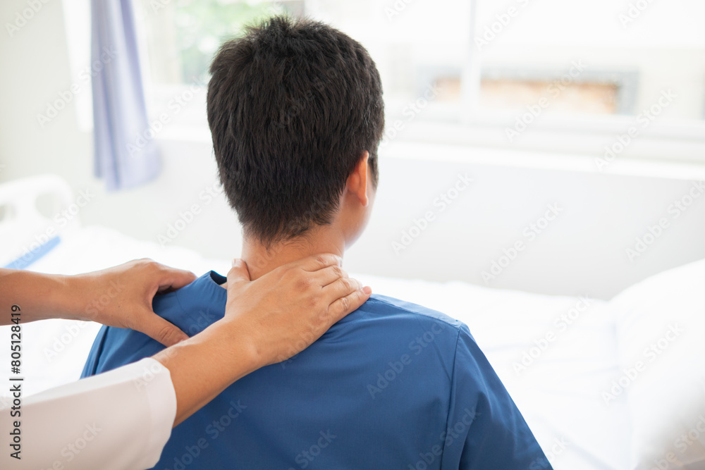man was admitted for treatment of muscle pain in back of his shoulder due to working hard and causing muscle inflammation. doctor is treating man muscle pain in his back and shoulders due to overwork. man was admitted for treatment of muscle pain in back of his shoulder due to working hard and causing muscle inflammation. doctor is treating man muscle pain in his back and shoulders due to overwork.