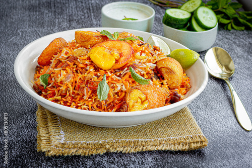 Indian Spicy Egg Biryani Popular Indian One Pot Rice Dish Served with Yogurt and Lemon Top Down Indian Food Photo
